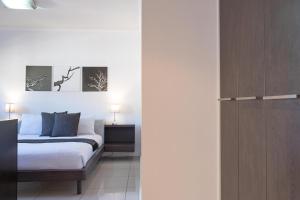 Postel nebo postele na pokoji v ubytování The Nicol Hotel Bedfordview