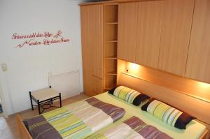 Ein Bett oder Betten in einem Zimmer der Unterkunft Uferresidenz Überlingen