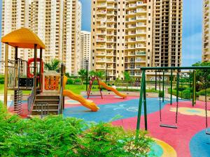 a park with a playground with a slide at The Karma Square near India Expo Mart in Noida