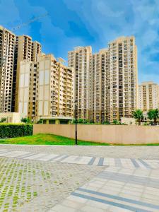 a row of tall apartment buildings in a city at The Karma Square near India Expo Mart in Noida