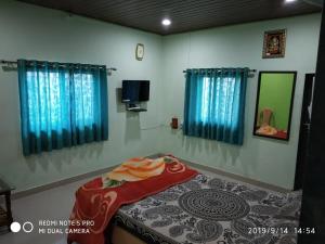 Vamoose Annai Shristhi客房内的一张或多张床位