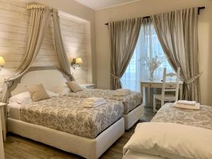 Postel nebo postele na pokoji v ubytování Casa Mia Vaticano Guest House