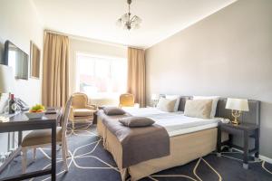 Voodi või voodid majutusasutuse Hotel Dania toas