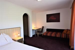 En eller flere senger på et rom på Hotel Sommerer - inklusive Joker Card im Sommer