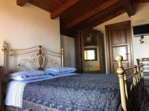 Posteľ alebo postele v izbe v ubytovaní AGRITURISMO SPENNAGALLI