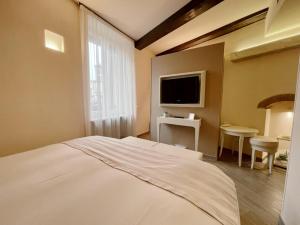 TV a/nebo společenská místnost v ubytování B&B Verona Centro