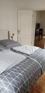 a bed sitting in a room with a door at Angela in Baden-Baden