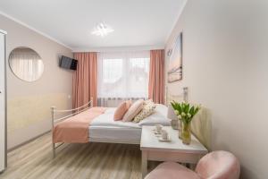Łóżko lub łóżka w pokoju w obiekcie Villa Rafałko