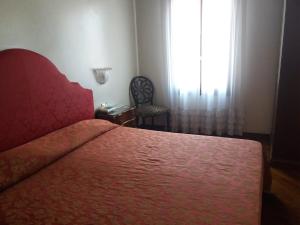 Postel nebo postele na pokoji v ubytování Hotel Piccola Fenice