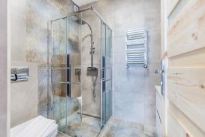 a shower stall in a bathroom with a toilet at OMORIKA - Wierch Rusiński in Bukowina Tatrzańska +77 photos