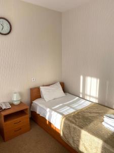 Кровать или кровати в номере Гостиничный комплекс Алмаз