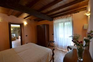 a bedroom with a bed and a window at Il Tiglio in Orvieto +34 photos