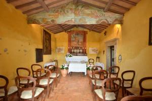 a room with chairs and a table in a building at Il Mandorlo in Orvieto