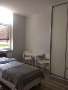 Postel nebo postele na pokoji v ubytování Hostelik Przy Przystanku