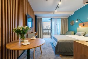 Ένα ή περισσότερα κρεβάτια σε δωμάτιο στο Seaside Apartaments Deluxe 105 +20 φωτογραφίες