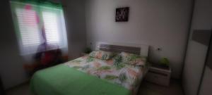 Postel nebo postele na pokoji v ubytování Apartmani Tomislav