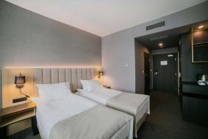 Posteľ alebo postele v izbe v ubytovaní B&B HOTEL Warsaw East