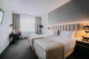 Posteľ alebo postele v izbe v ubytovaní B&B HOTEL Warsaw East