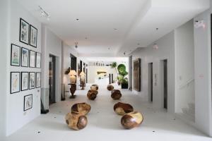 a hallway with wooden objects sitting on the floor at La Bella Boutique Hotel in Tagaytay