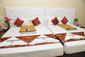 Postel nebo postele na pokoji v ubytování Rightchoicehotels