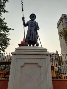 a statue of a woman standing on a pedestal at Hotel Tamanna - 50 Meter from Golden Temple in Amritsar
