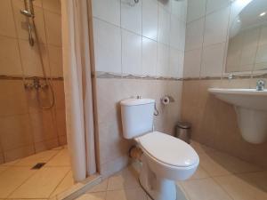 a bathroom with a toilet and a sink at Apartment Ashton Hall - Sonnenstrand – Ost in Sunny Beach