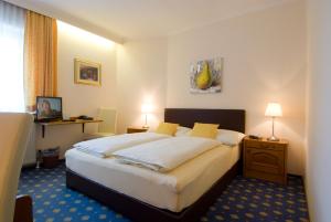 Postel nebo postele na pokoji v ubytování Hotel Biedermeier Hof