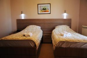Posteľ alebo postele v izbe v ubytovaní Garni Hotel Crystal Ice