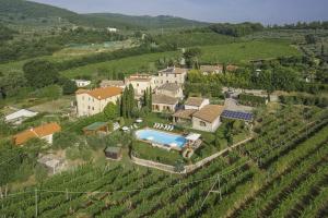 an aerial view of a house in a vineyard at Villa di Capannole 12 in Bucine