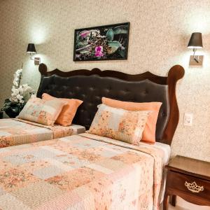 Cama ou camas em um quarto em Terra dos Diamantes Hotel