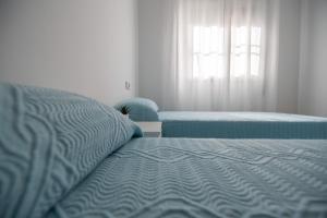 Postel nebo postele na pokoji v ubytování Casa Riu Avall