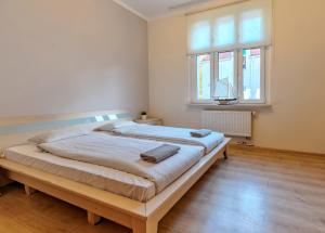 Postel nebo postele na pokoji v ubytování Mieszkanie Polonia - ACCO RENT