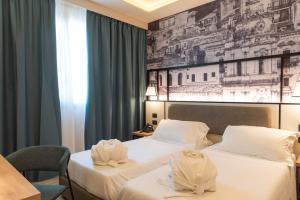 Modica Boutique Hotel客房内的一张或多张床位