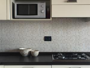 A kitchen or kitchenette at Appartamento Francesco - Theater Home