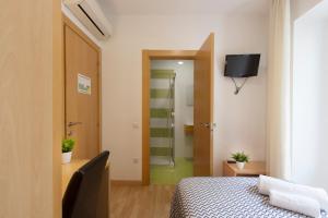 Postel nebo postele na pokoji v ubytování Hostal La Numantina