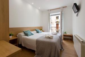 Postel nebo postele na pokoji v ubytování Hostal La Numantina