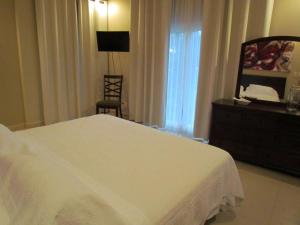 Voodi või voodid majutusasutuse Tamarindo Condo 206 Matapalo toas