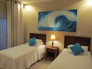 Voodi või voodid majutusasutuse Tamarindo Condo 206 Matapalo toas