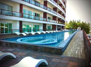 a swimming pool in front of a building at Oceanview Luxury, Pool, Near Tour Boats & Beach in Puerto Vallarta