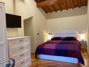 Tempat tidur dalam kamar di Le Casette di Viola