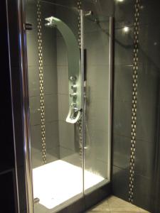 a shower with a glass door in a bathroom at Domaine de Gaudon in Ceilloux +62 photos