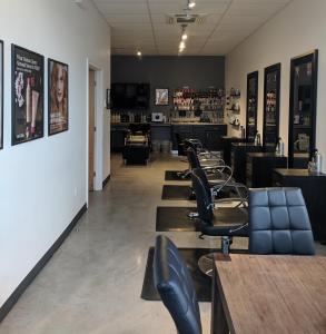 a row of chairs and tables in a barber shop at Micro Boutique Living Wolfville in Wolfville