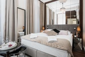 Posteľ alebo postele v izbe v ubytovaní Salomea Krakow apartments