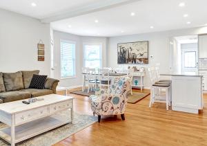 a living room with a couch and a table at Stylish house one block to beach with linens and parking in Point Pleasant Beach