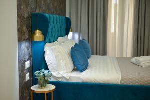 Postel nebo postele na pokoji v ubytování Hotel Capital Inn Tirana