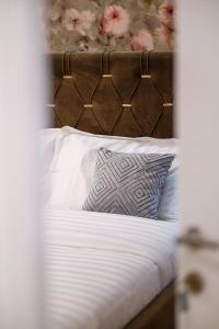 Postel nebo postele na pokoji v ubytování Hotel Capital Inn Tirana