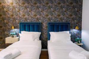 Posteľ alebo postele v izbe v ubytovaní Rama's Hotel