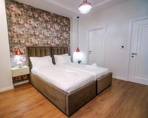 Postel nebo postele na pokoji v ubytování Hotel Capital Inn Tirana