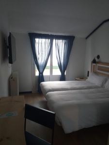 Cama o camas de una habitación en Hotel Alda Jolio Jaca