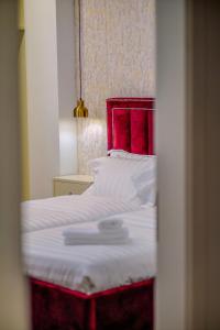 Postel nebo postele na pokoji v ubytování Hotel Capital Inn Tirana